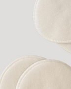 Close-up of beige bra cups with a light gray background