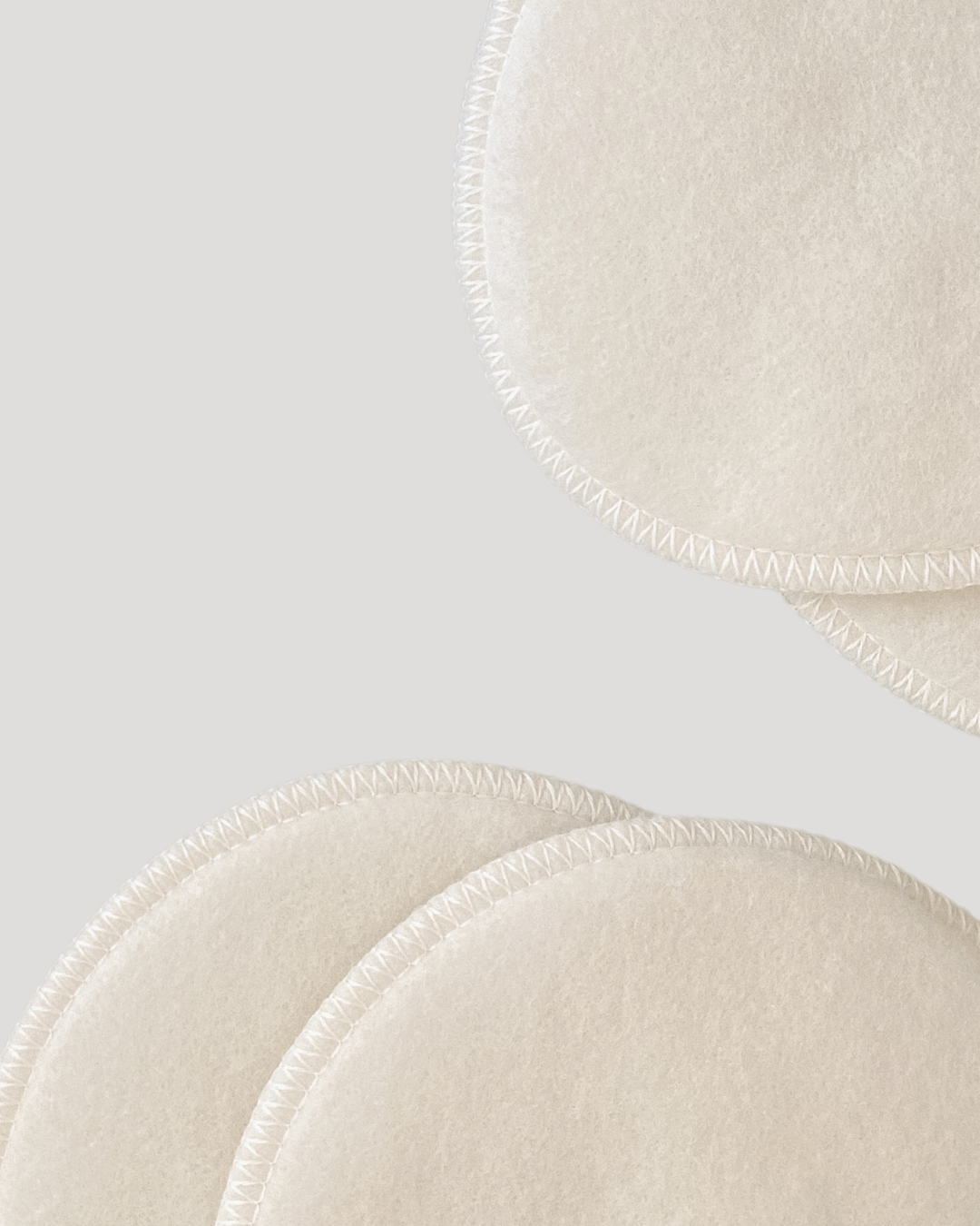 Close-up of beige bra cups with a light gray background