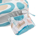 Colorful patterned fabric with a drawstring pouch on a white background