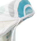 Close-up of a white drawstring bag with a blue and white patterned lid on a white background