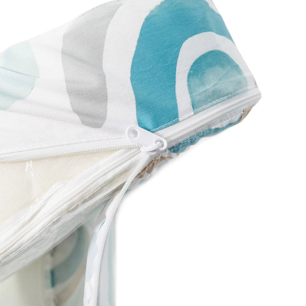 Close-up of a white drawstring bag with a blue and white patterned lid on a white background