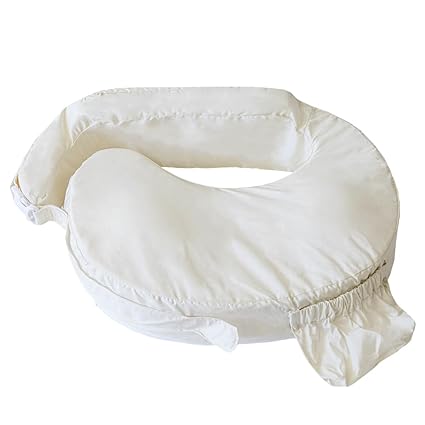 My Brest Friend nursing pillow in a solid off-white cotton fabric, featuring a wrap-around cushion design, integrated back support, and a front accessory pocket