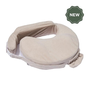 Tan-colored nursing pillow with armrests and a secure buckle, designed for comfort and support. "New" label in a dark green badge at the top right.
