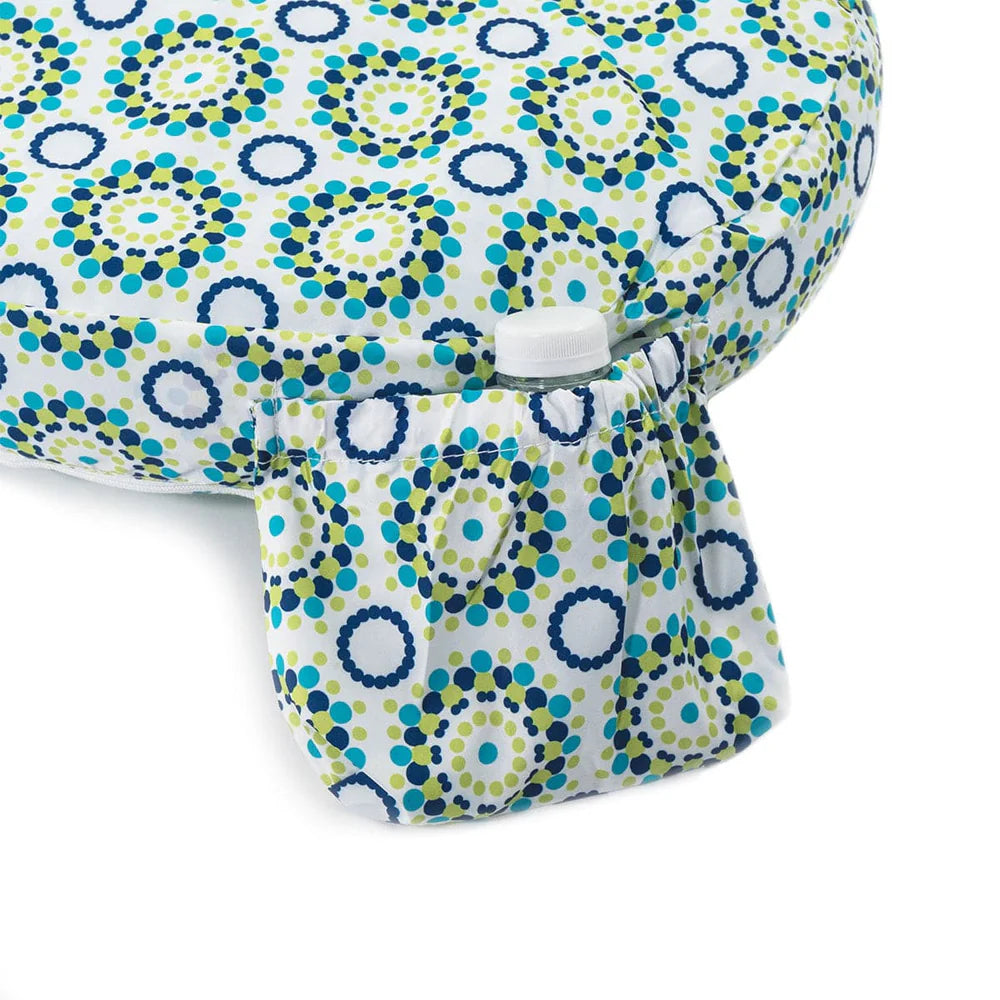 Patterned Nursing pillow cover with circular designs on a white background
