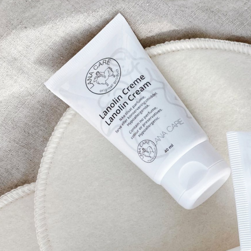 LANACare Lanolin Cream tube on a textured beige surface