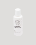 White bottle labeled 'Lanolin Soap' on a gray background