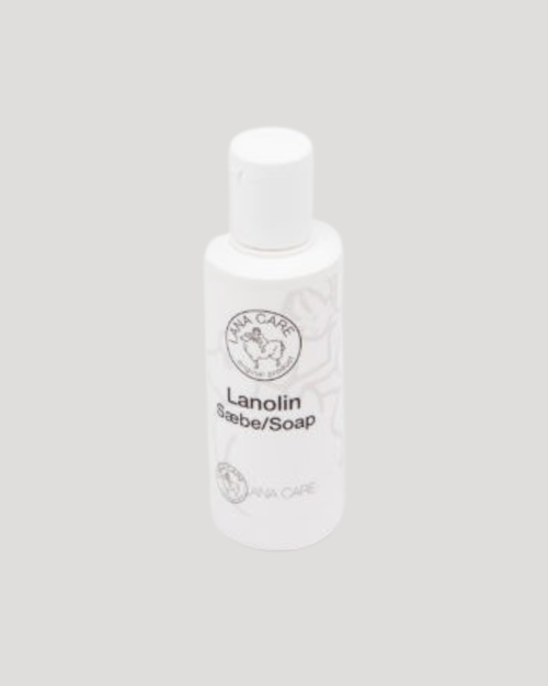 White bottle labeled 'Lanolin Soap' on a gray background