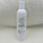 White bottle of Lanolin Soap on a textured surface