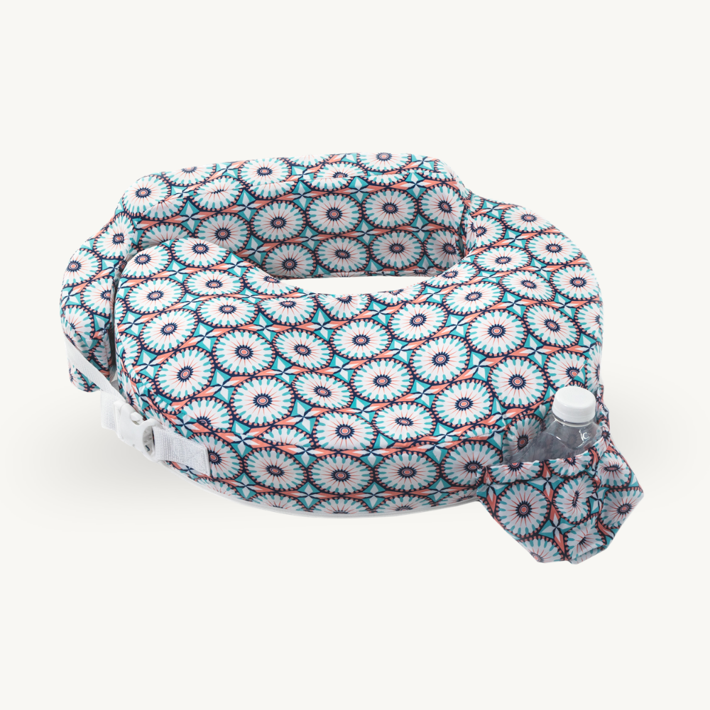 Floral patterned seat cover with a water bottle on a white background