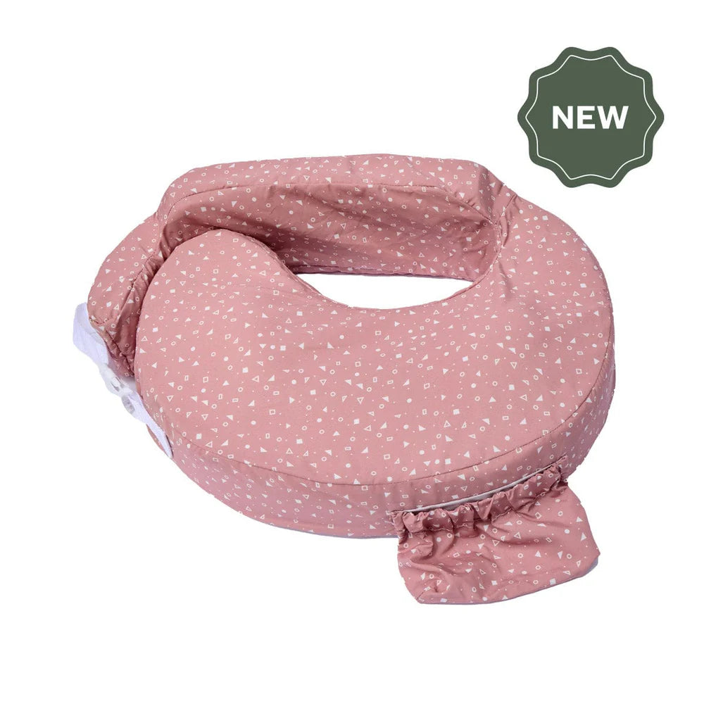 Pink nursing pillow with white polka dots on a white background, featuring a 'NEW' label.