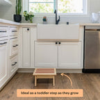 Kitchen with a wooden step stool placed on the floor, ideal for toddlers.