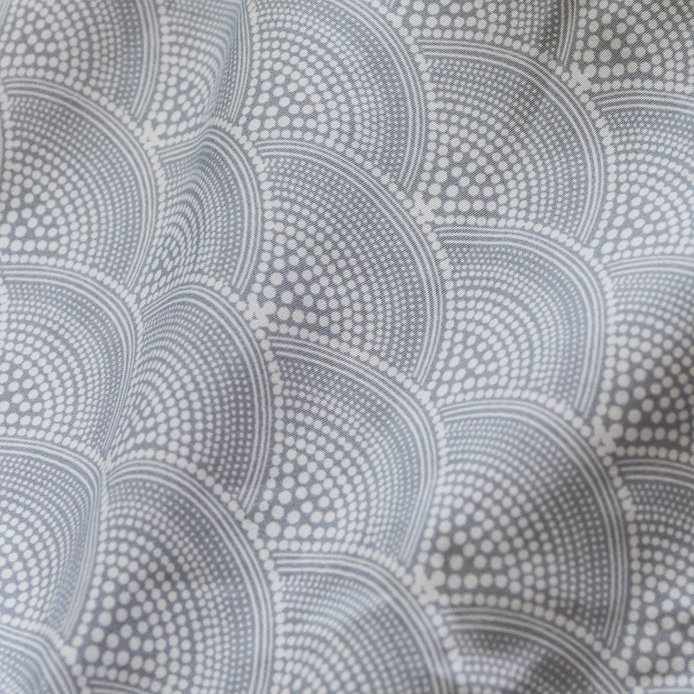 Patterned fabric with circular design in gray tones