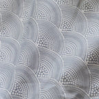 Patterned fabric with circular design in gray tones