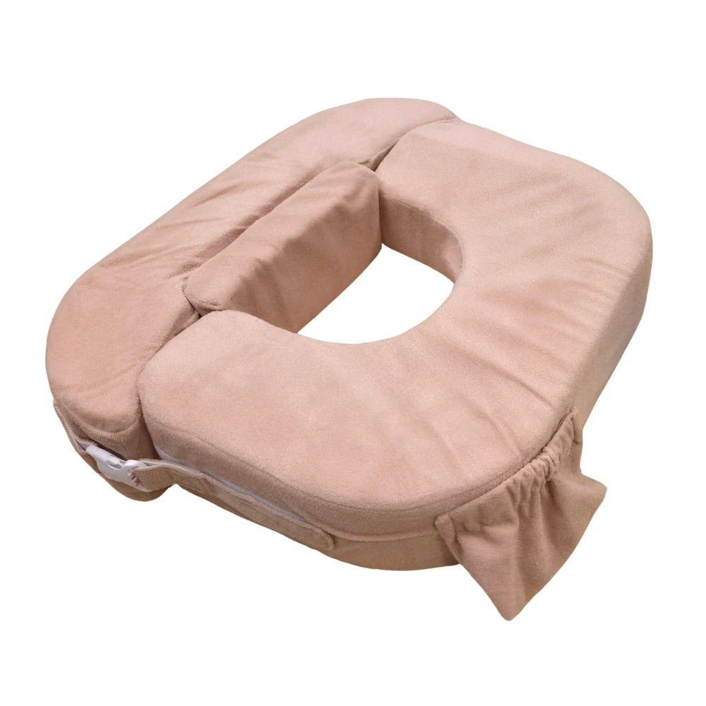 Beige U-shaped pillow on a white background