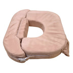 Beige U-shaped pillow on a white background