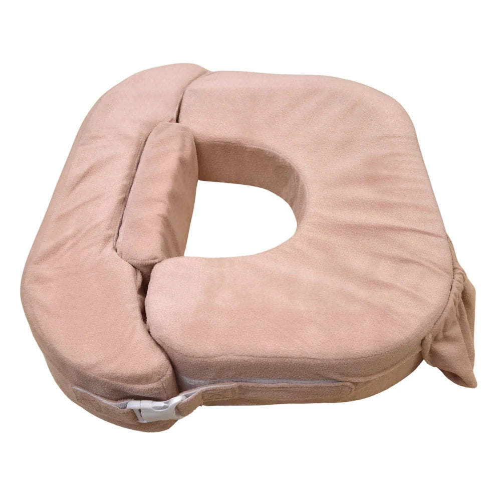Beige U-shaped pillow on a white background