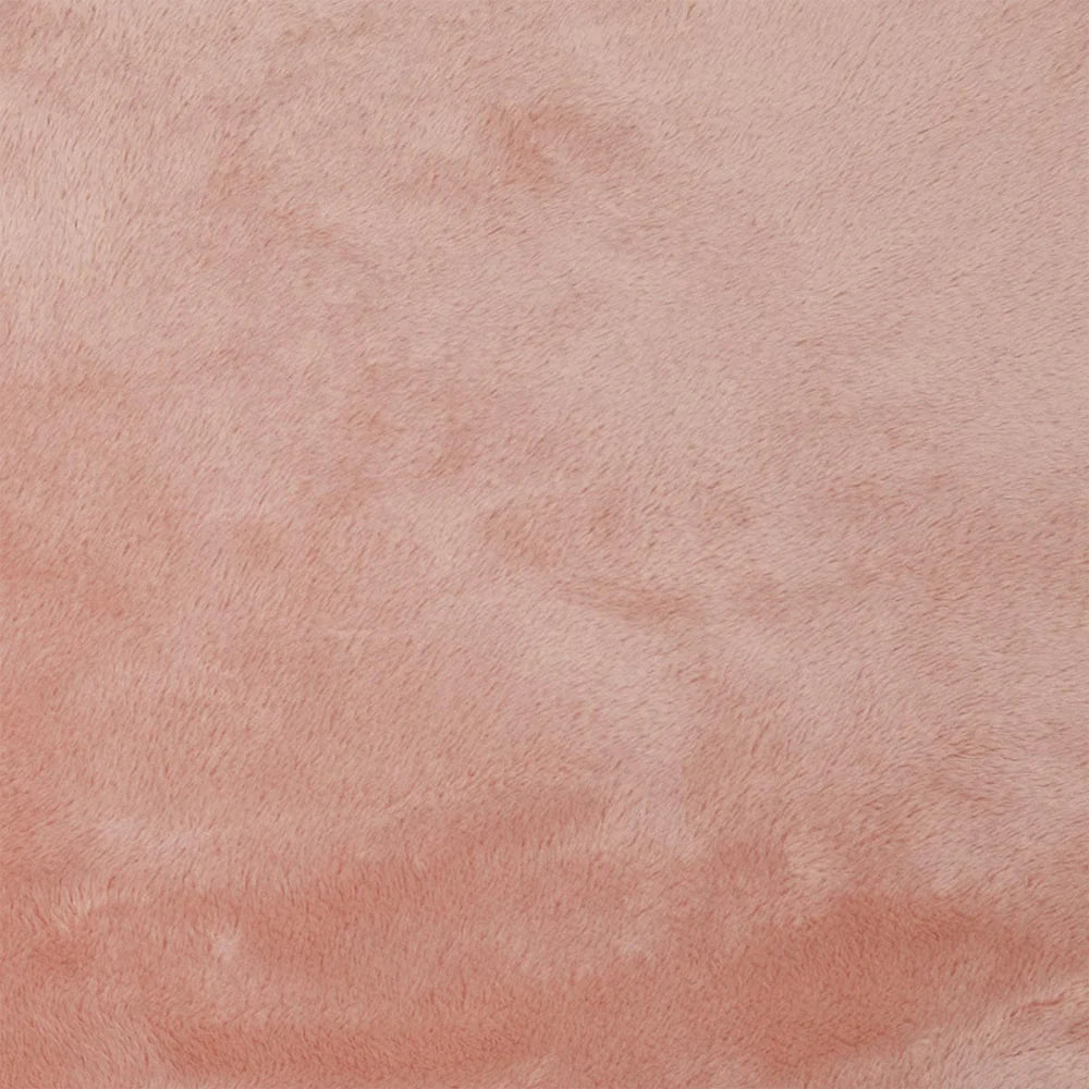 Textured pink surface with a subtle pattern